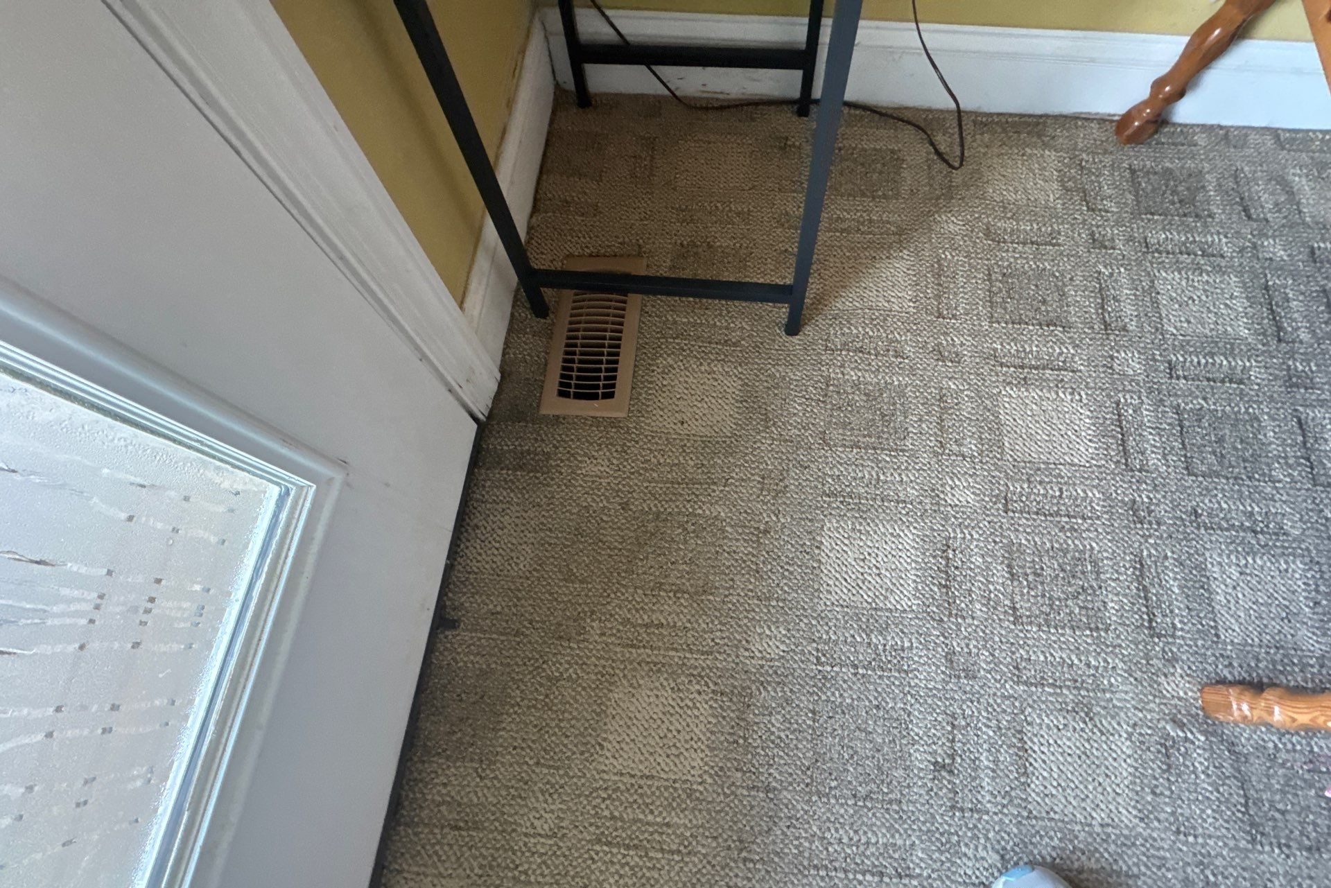Carpeted floor and trim beside the repaired entry threshold in Oak Island, NC