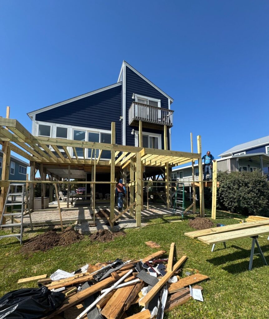 Elevated deck framing and new wood supports during rebuilding in Oak Island, NC