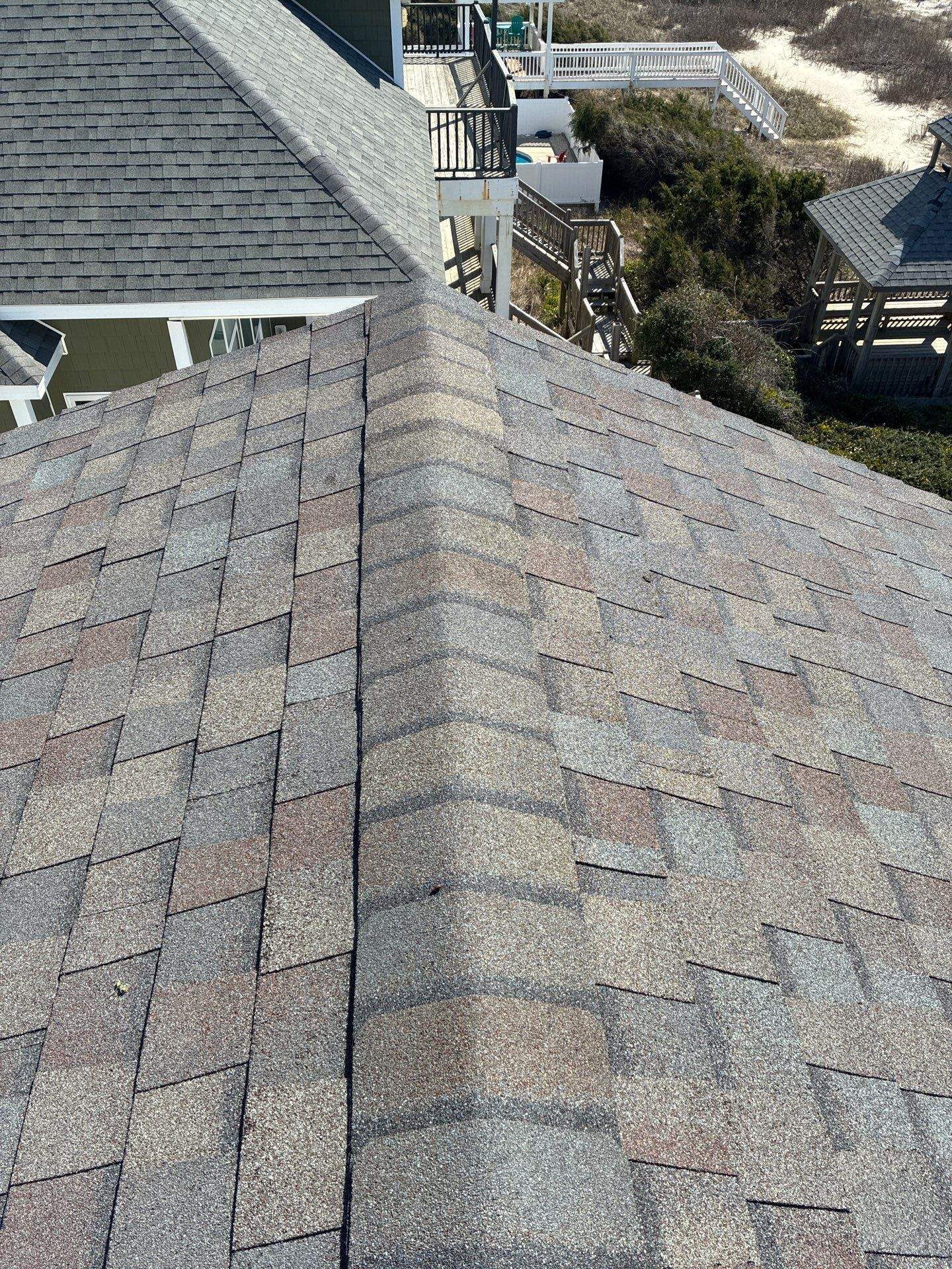 Ridge caps along the roof viewed toward the street in Oak Island, NC