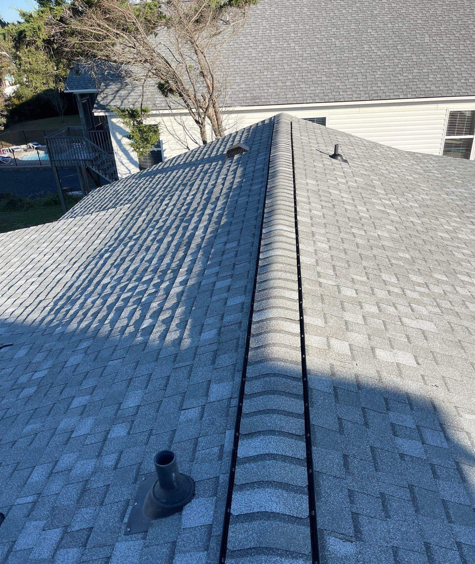 Gray shingle courses along the roof ridge in Oak Island, NC