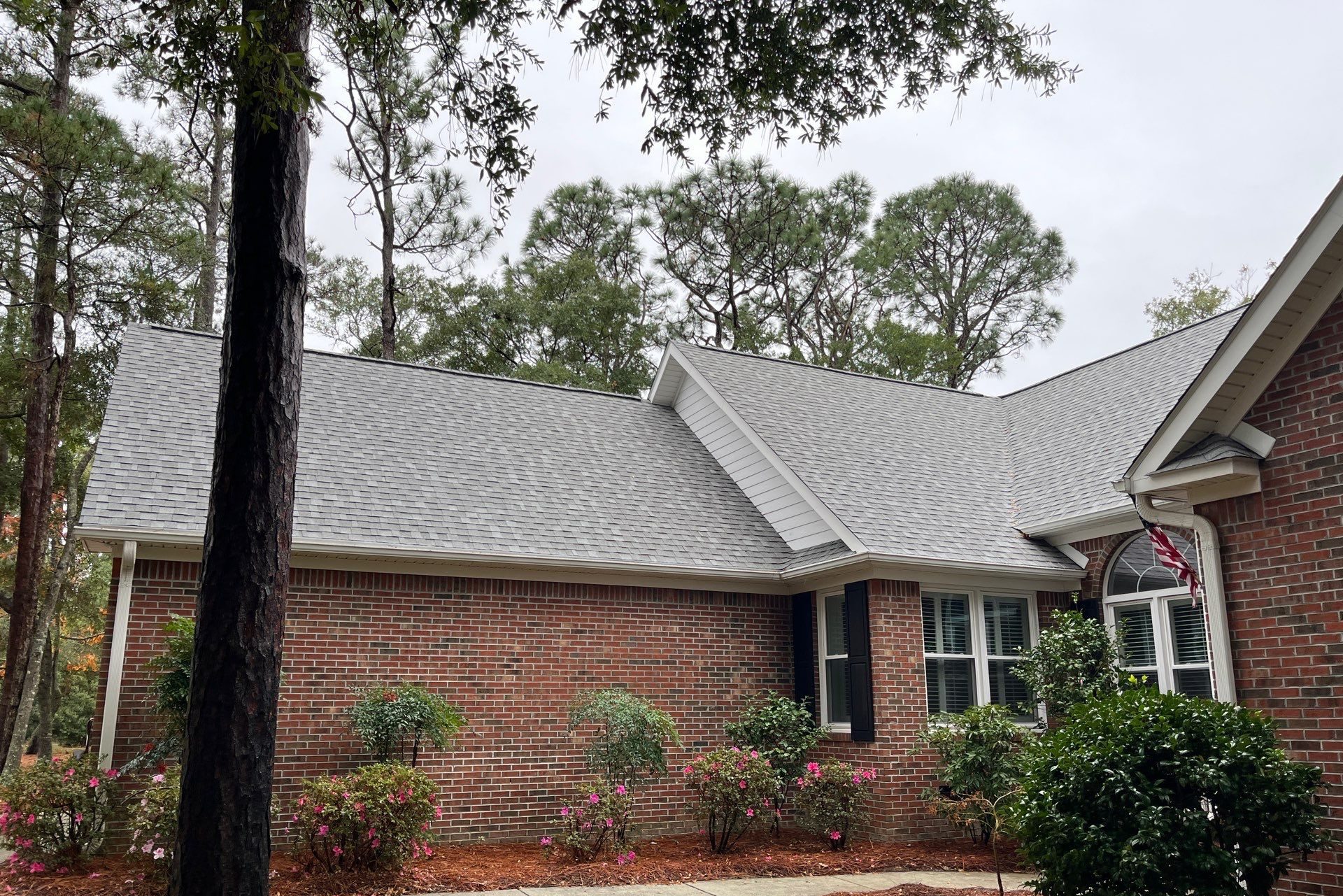 Finished shingle roof above the brick front elevation in Oak Island, NC