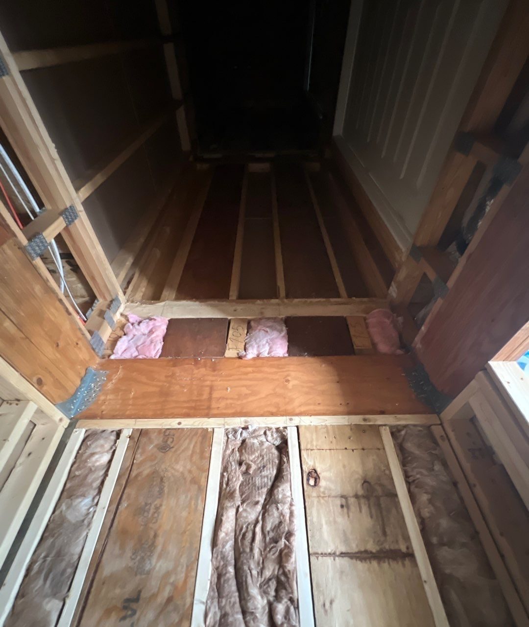 Framed elevator chase with structural beam and exposed wall cavities in Oak Island, NC