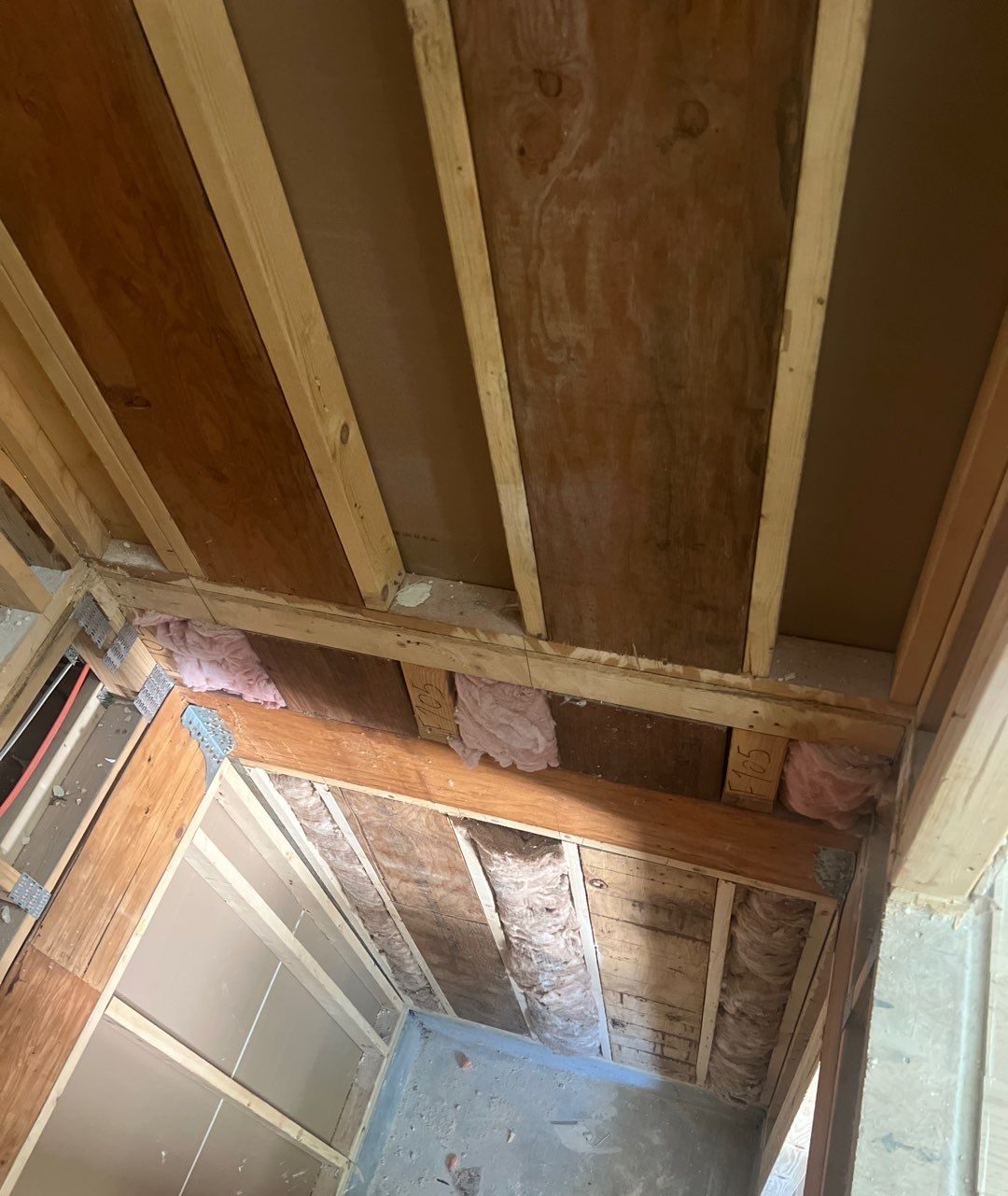 Underside of floor framing and beam at the shaft opening in Oak Island, NC