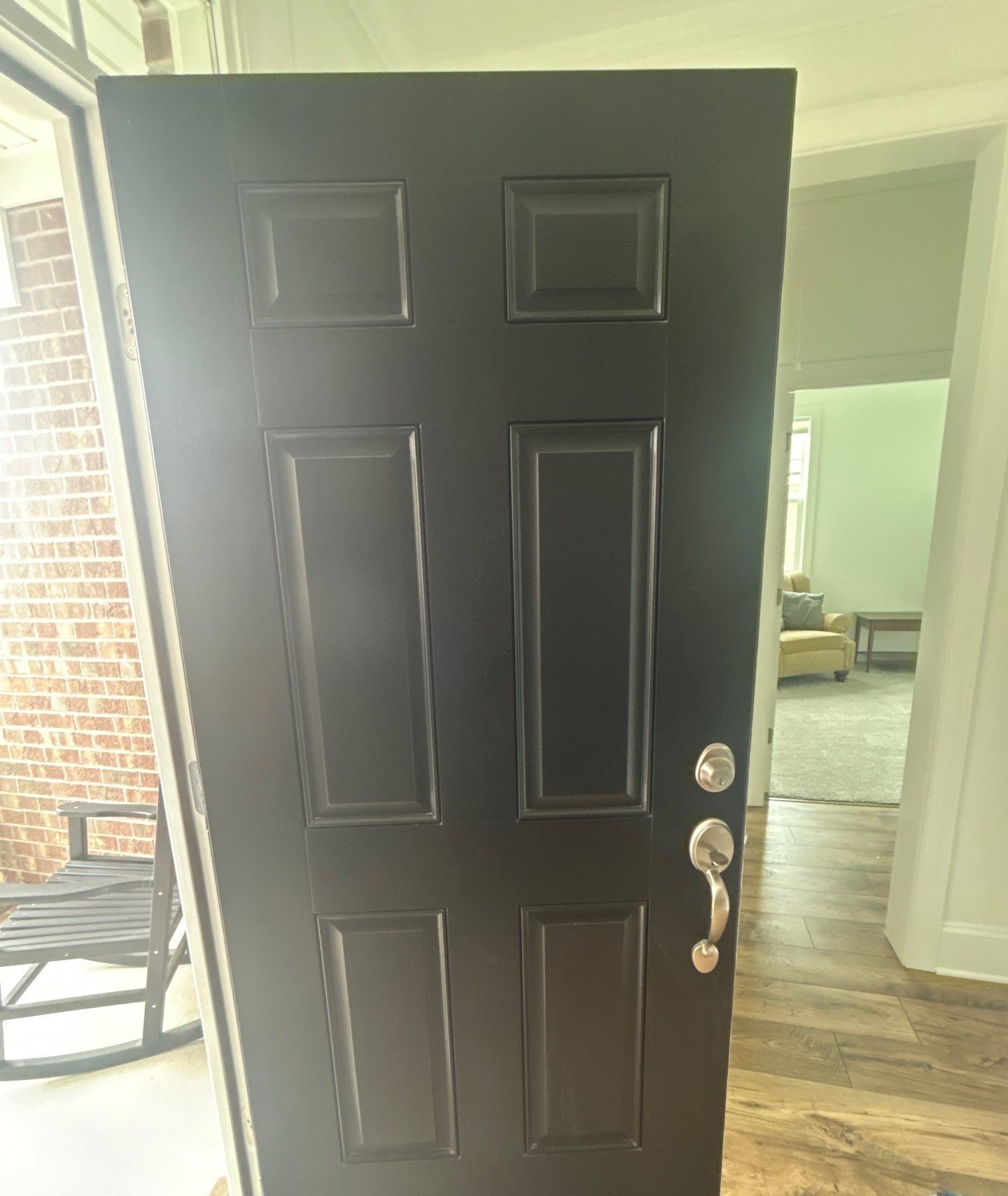Interior face of the black entry door and matching trim in Bolivia, NC