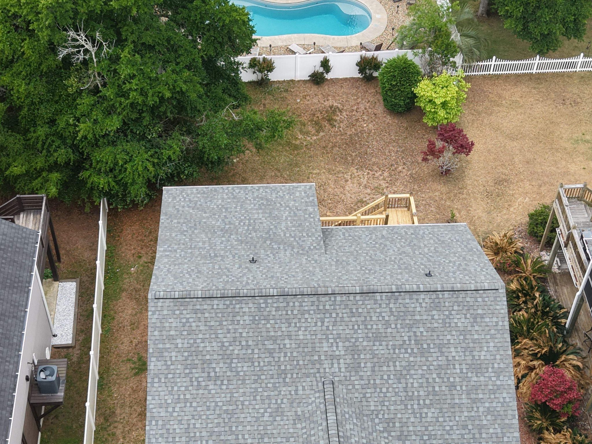 Roof and backyard pool viewed from above in Oak Island, NC