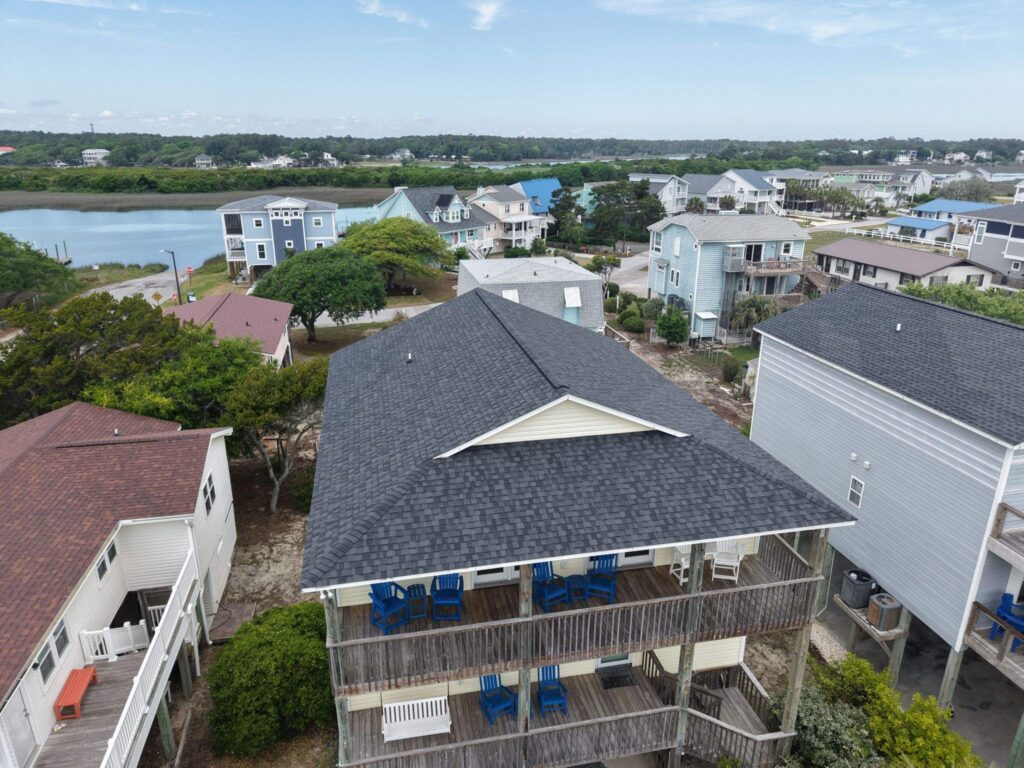 Oblique aerial view of the shingle roof above the porch in Oak Island, NC