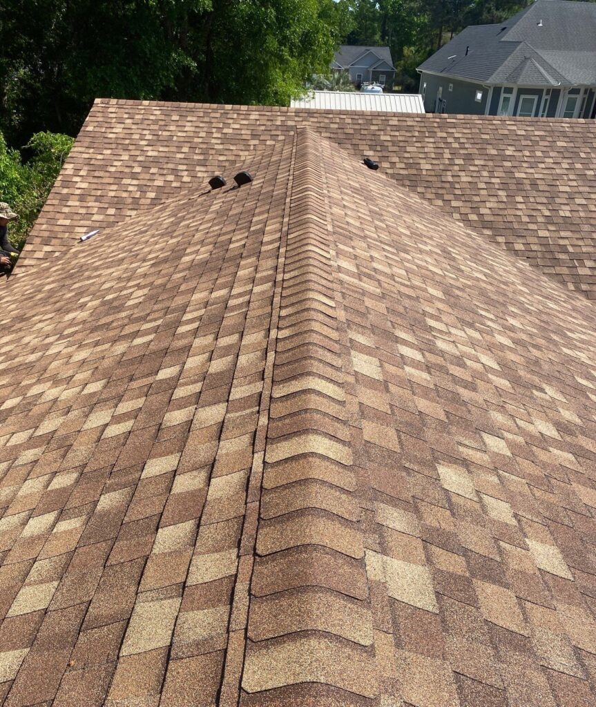 Shingle courses and ridge caps on the roof in Sunset Beach, NC