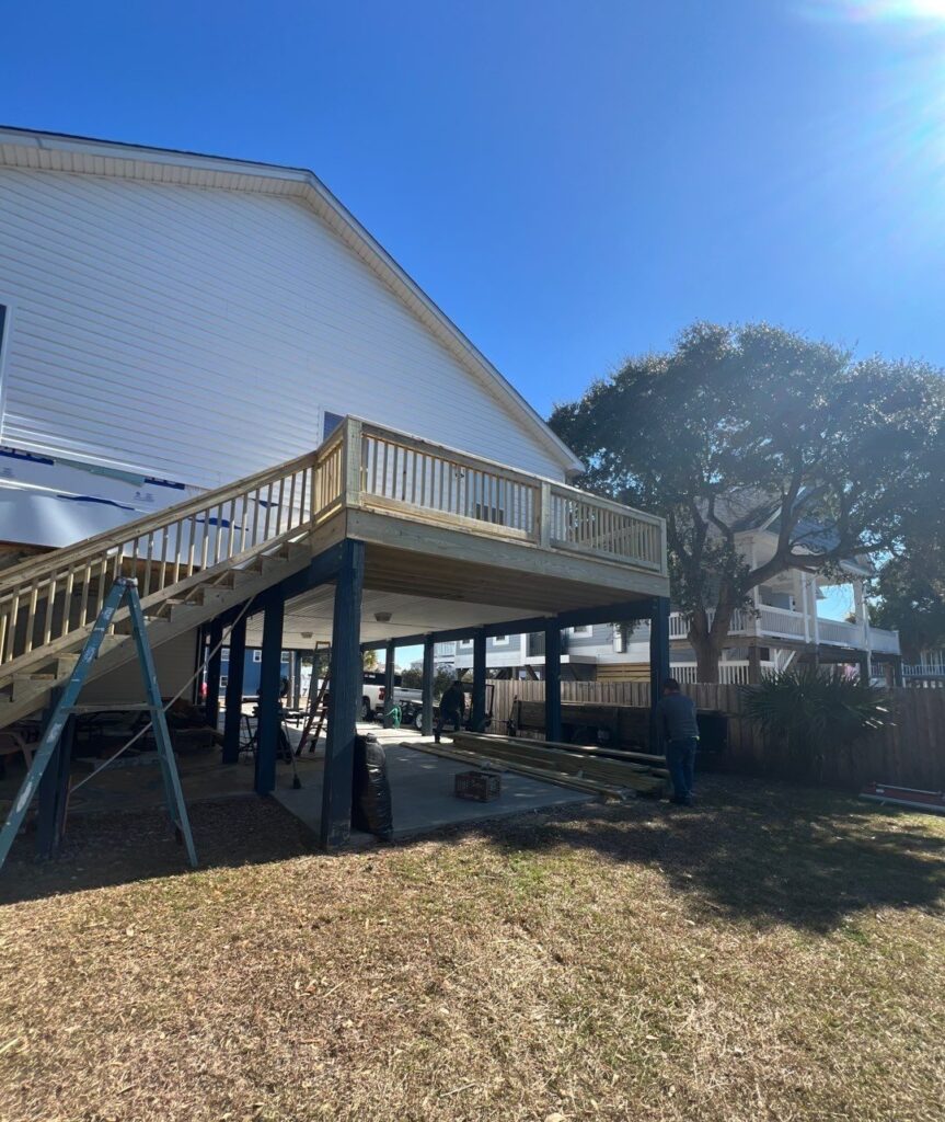New wood deck railing and exterior stair flight in Oak Island, NC