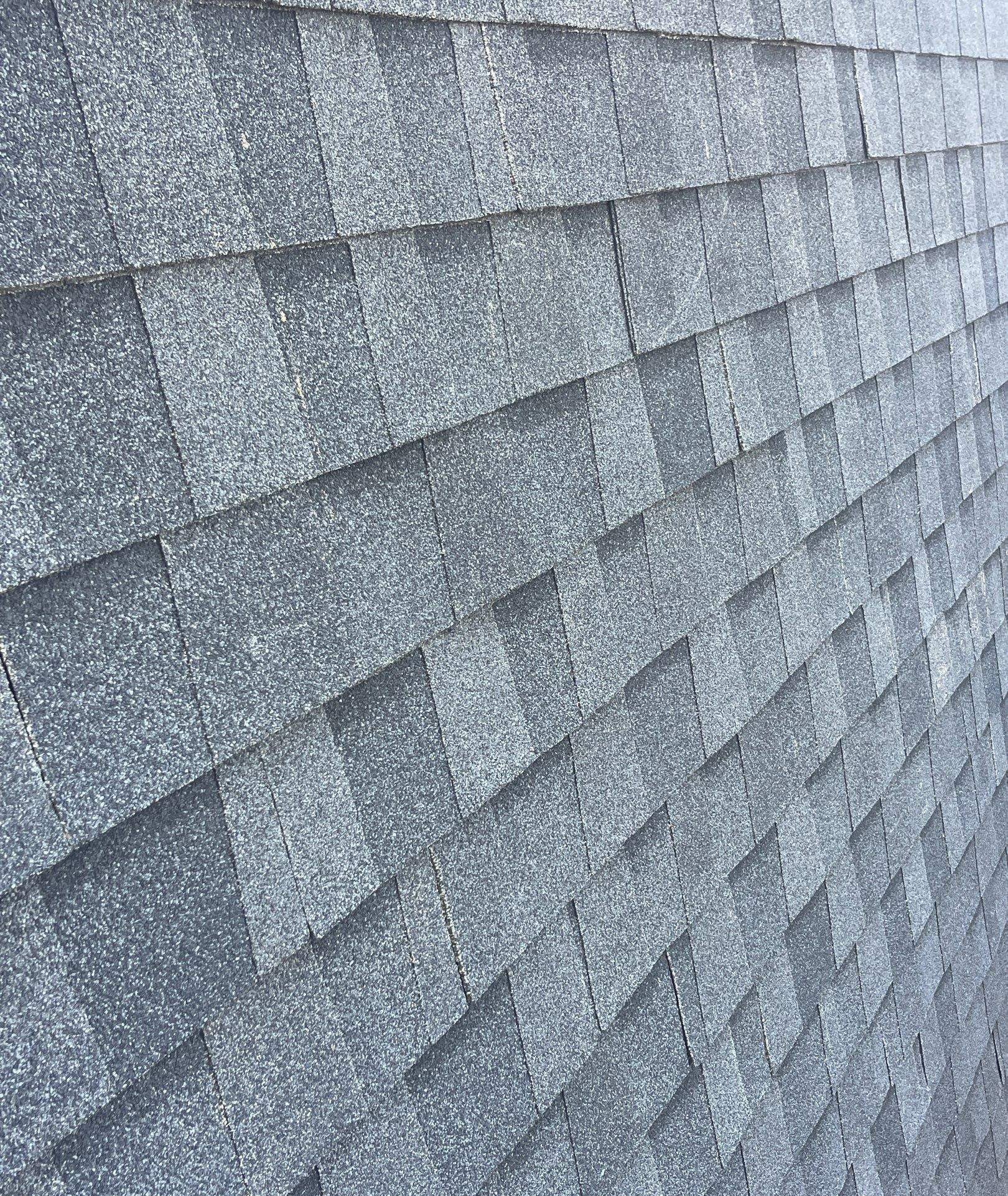 Close view of dark architectural shingle courses in Oak Island, NC