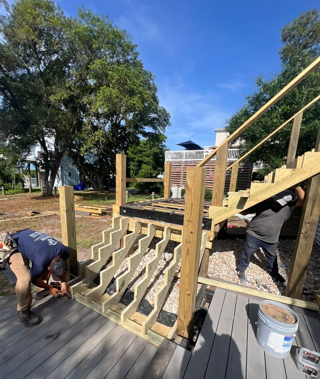 Stair framing and handrail assembly during construction in Oak Island, NC